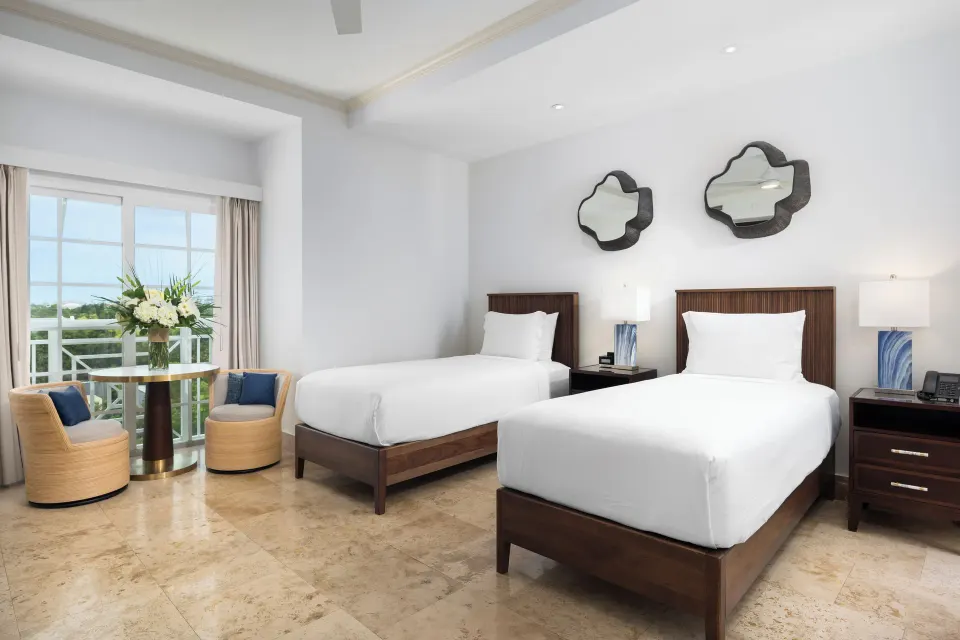 Studio two twin beds with balcony seating at Windsong on the Reef.