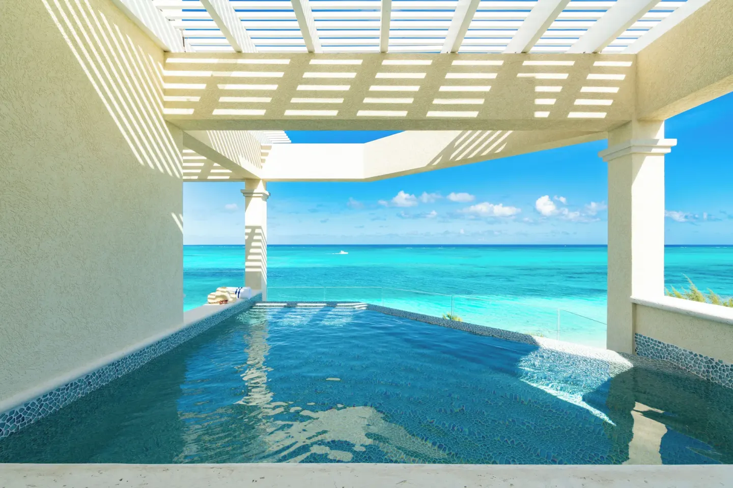 Beachfront villa terrace plunge pool overlooking the ocean at Windsong on the Reef.
