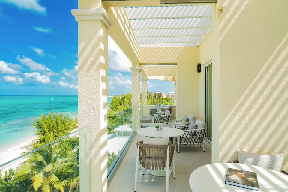 Beachfront two-bedroom villa terrace with ocean views at Windsong on the Reef.