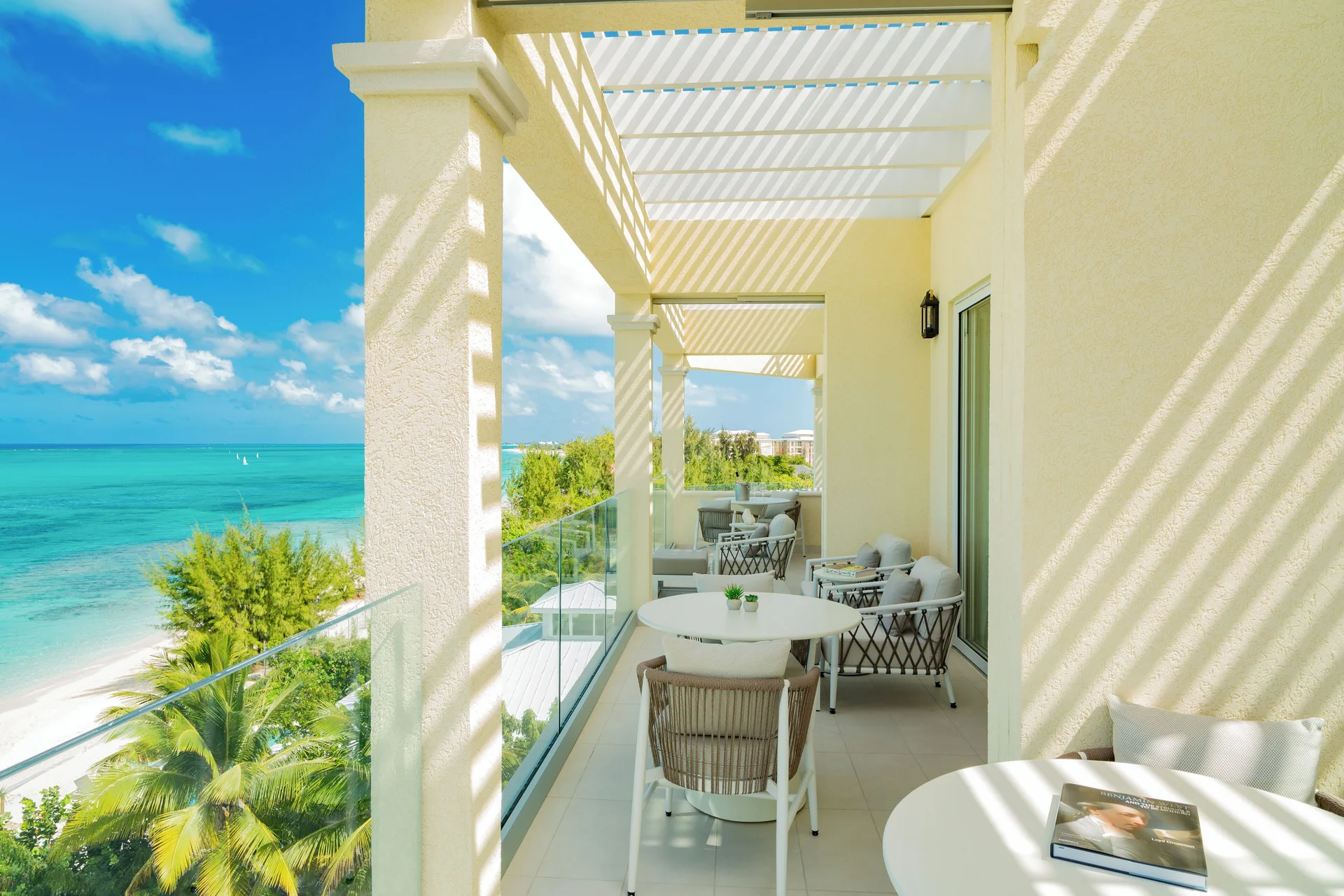 Beachfront two-bedroom villa terrace with ocean views at Windsong on the Reef.