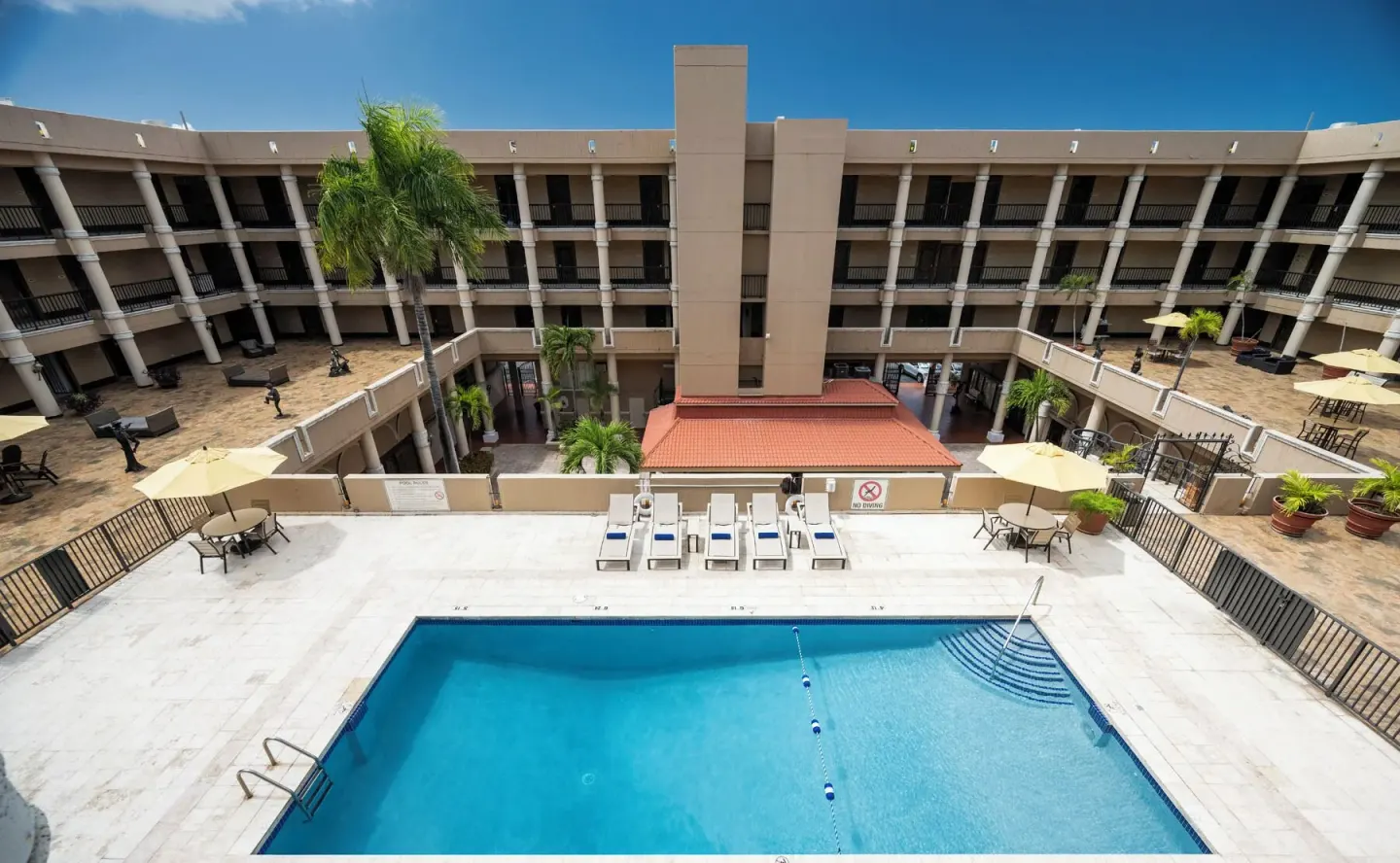 Courtyard pool viewed from above at Windward Passage Hotel.