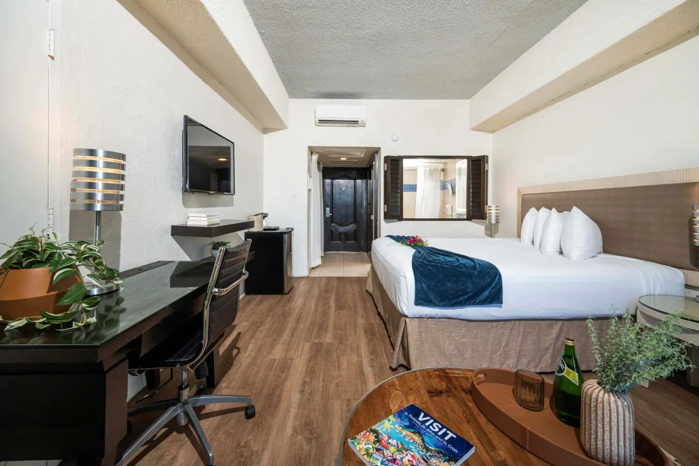 Superior Ocean View room with king bed and desk at Windward Passage Hotel.