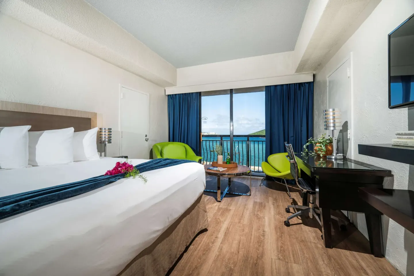 Superior Ocean View room with king bed and ocean-facing balcony at Windward Passage Hotel.