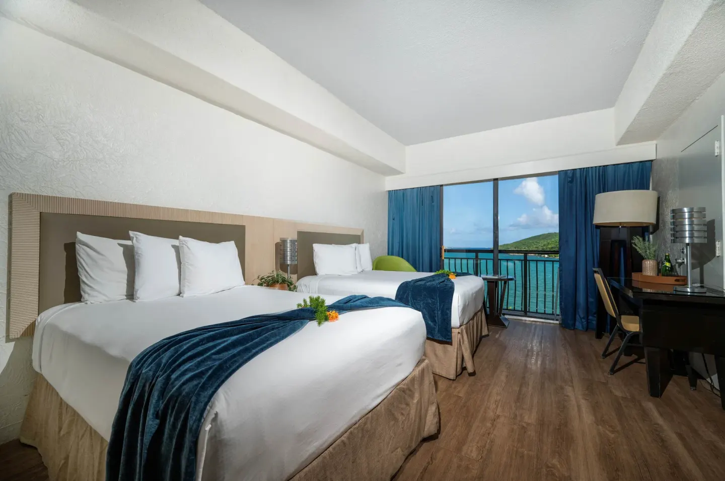 Superior Room Ocean View two beds and balcony at Windward Passage Hotel.