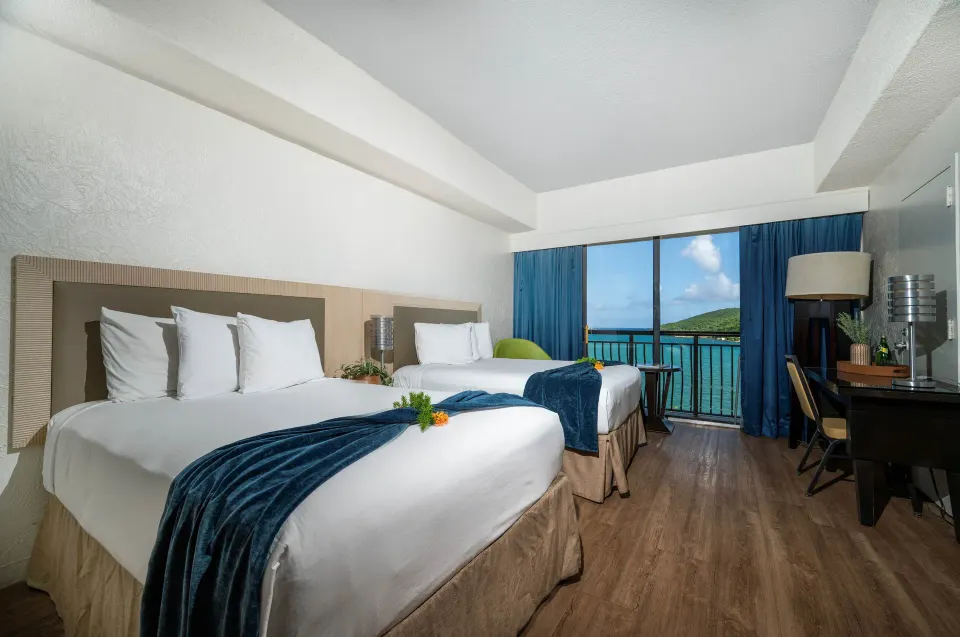 Superior Room Ocean View two beds and balcony at Windward Passage Hotel.
