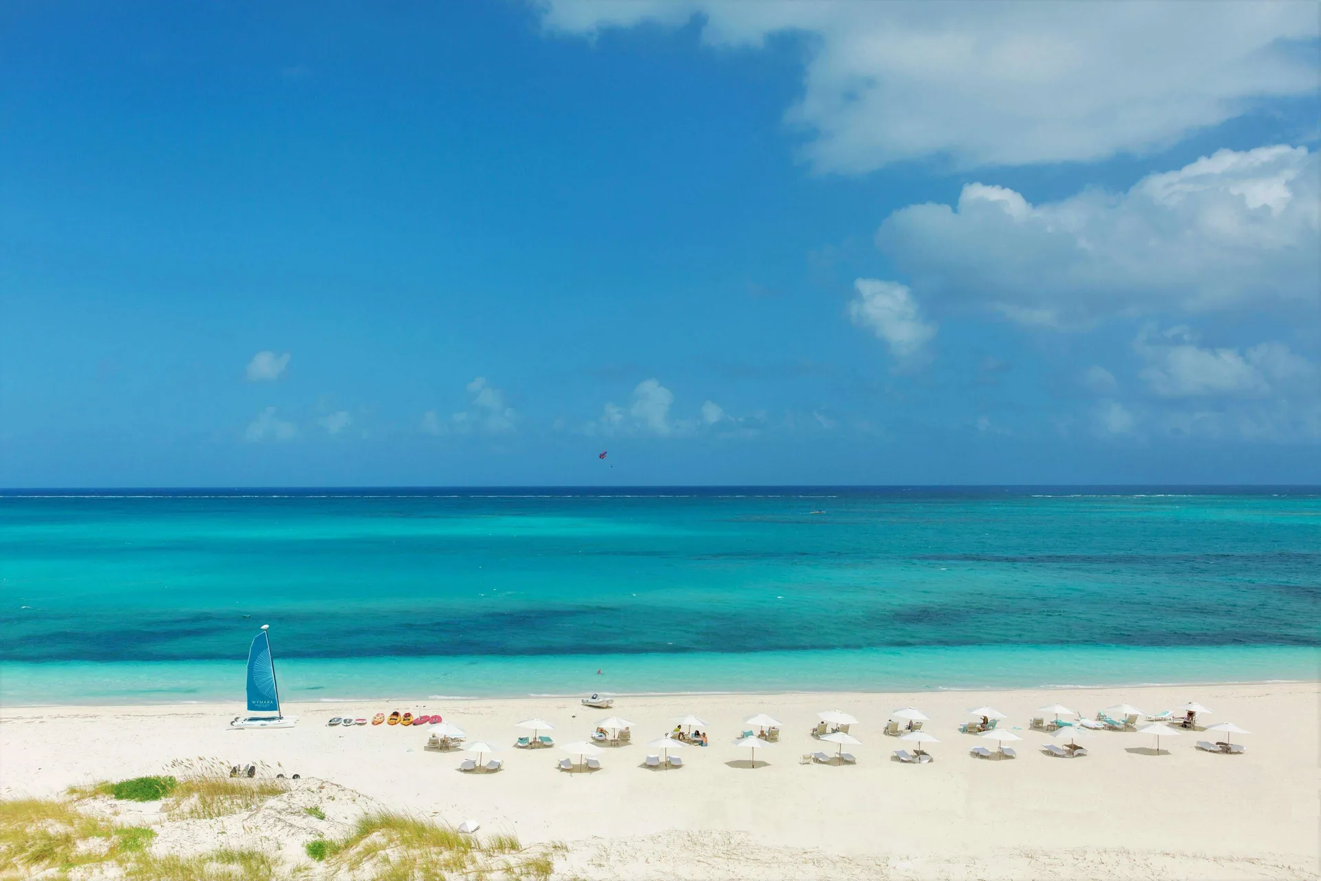 White sand beach and turquoise ocean at Wymara Resort and Villas.
