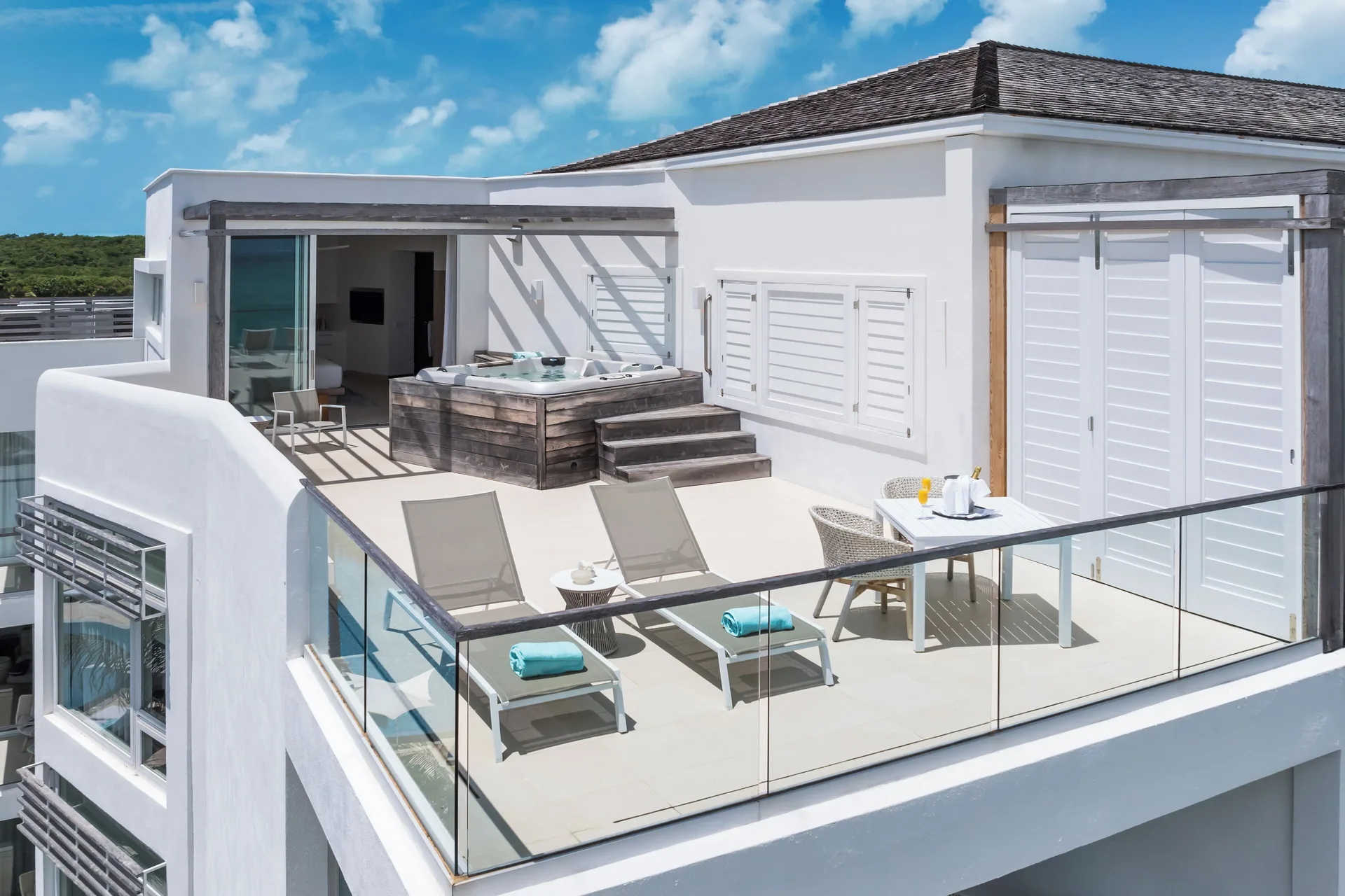 Large private rooftop terrace with hot tub and loungers at Wymara Resort and Villas.