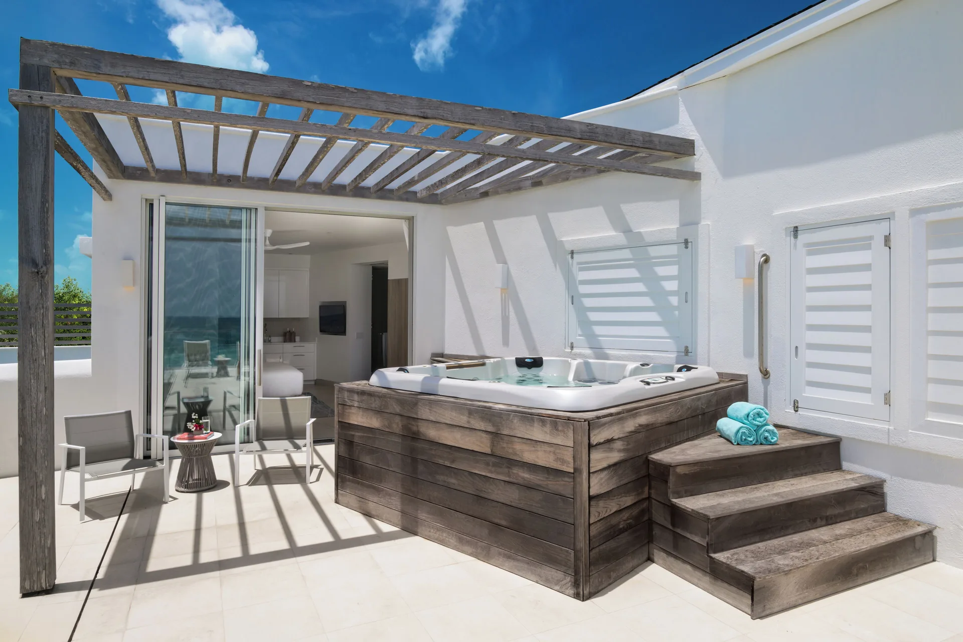 Rooftop terrace with hot tub and pergola at Wymara Resort and Villas.