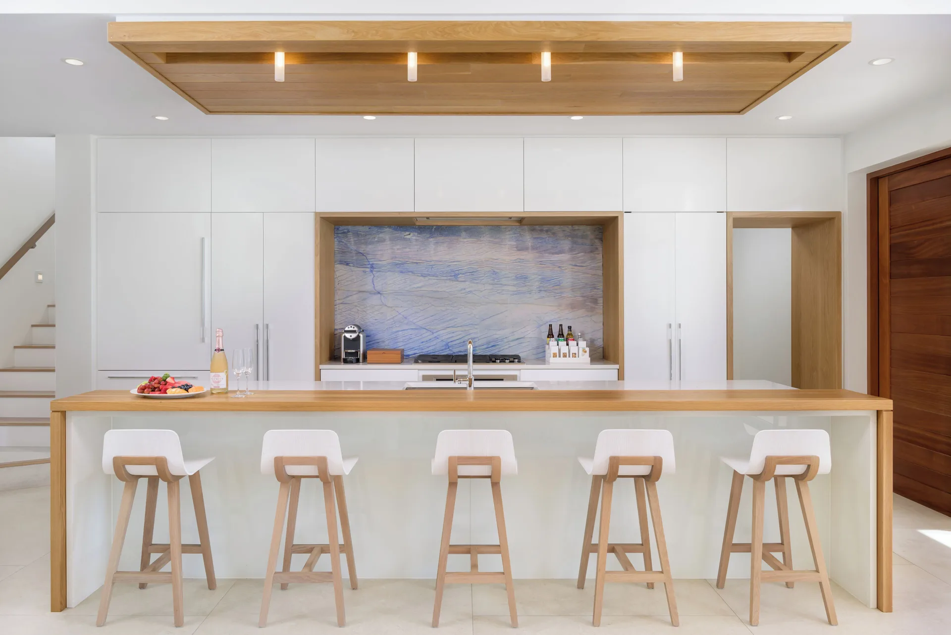 Villa kitchen island with stools at Wymara Resort and Villas.