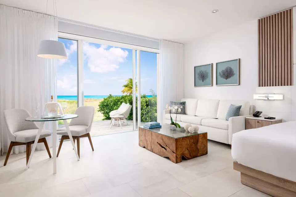 Deluxe Studio Oceanfront living area and terrace view at Wymara Resort and Villas.