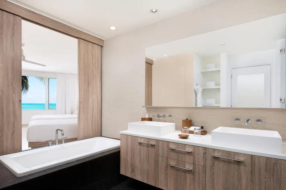 Grand Studio Oceanfront bathroom with double sinks and tub at Wymara Resort and Villas.