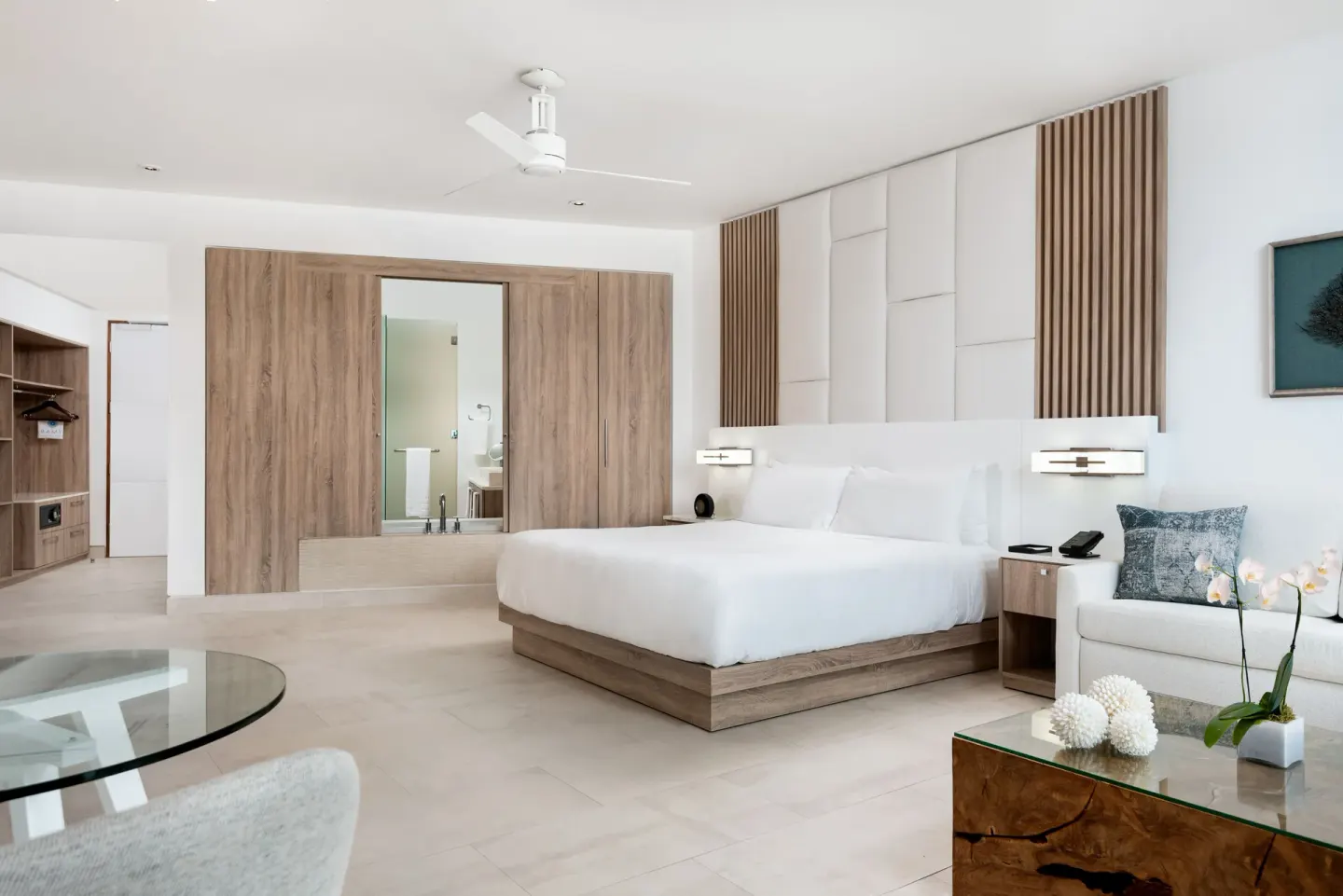 Grand Studio Oceanfront room with king bed and seating at Wymara Resort and Villas.