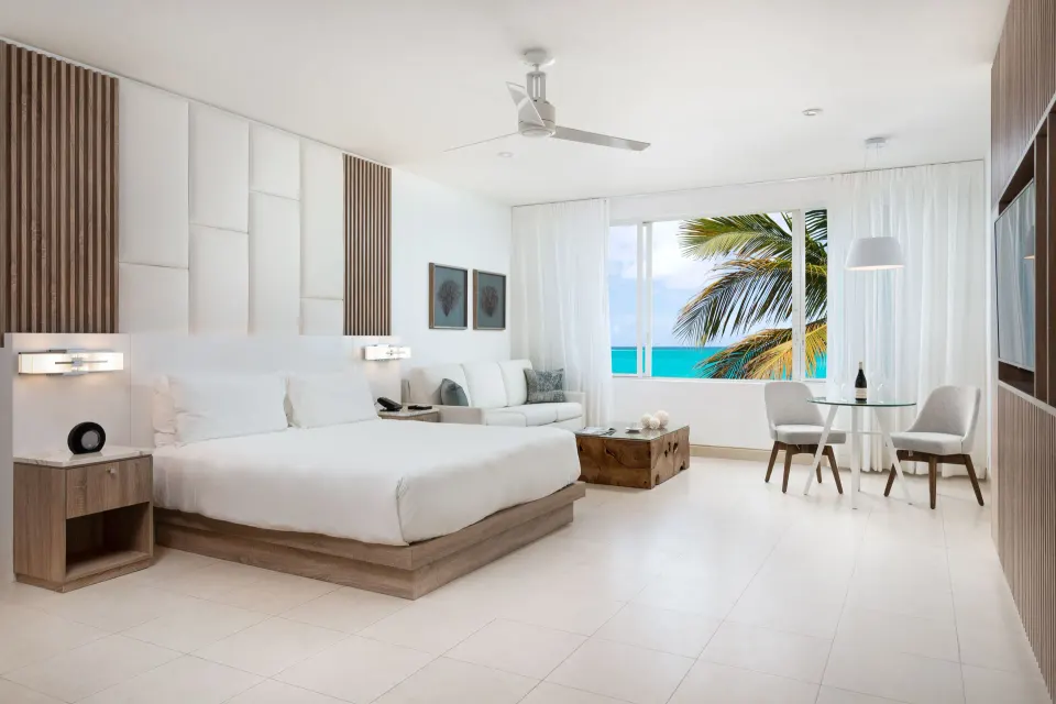 Grand Studio Oceanfront room with king bed and sea view at Wymara Resort and Villas.