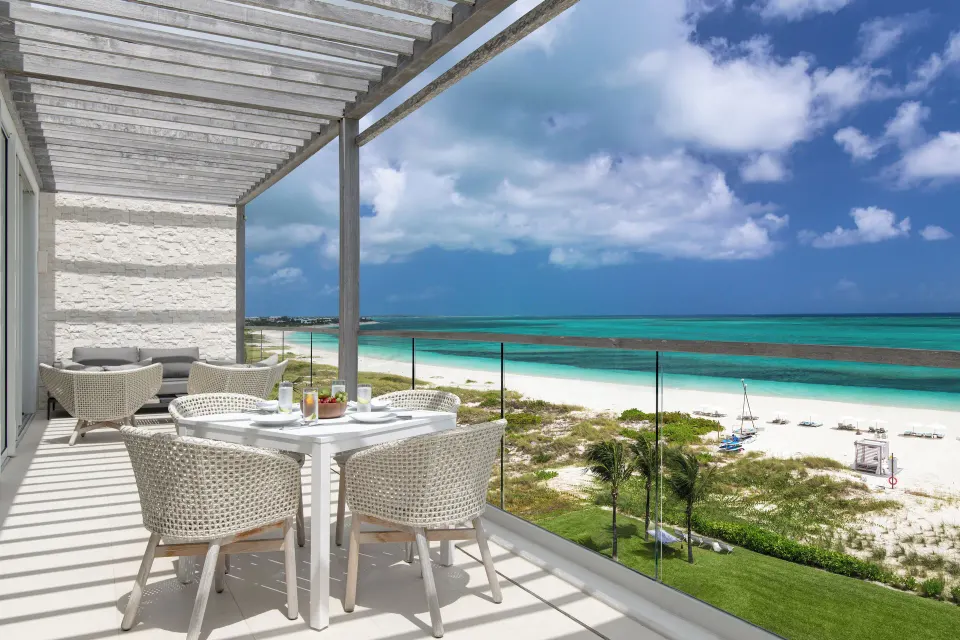 Penthouse one-bedroom suite balcony overlooking the beach at Wymara Resort and Villas.