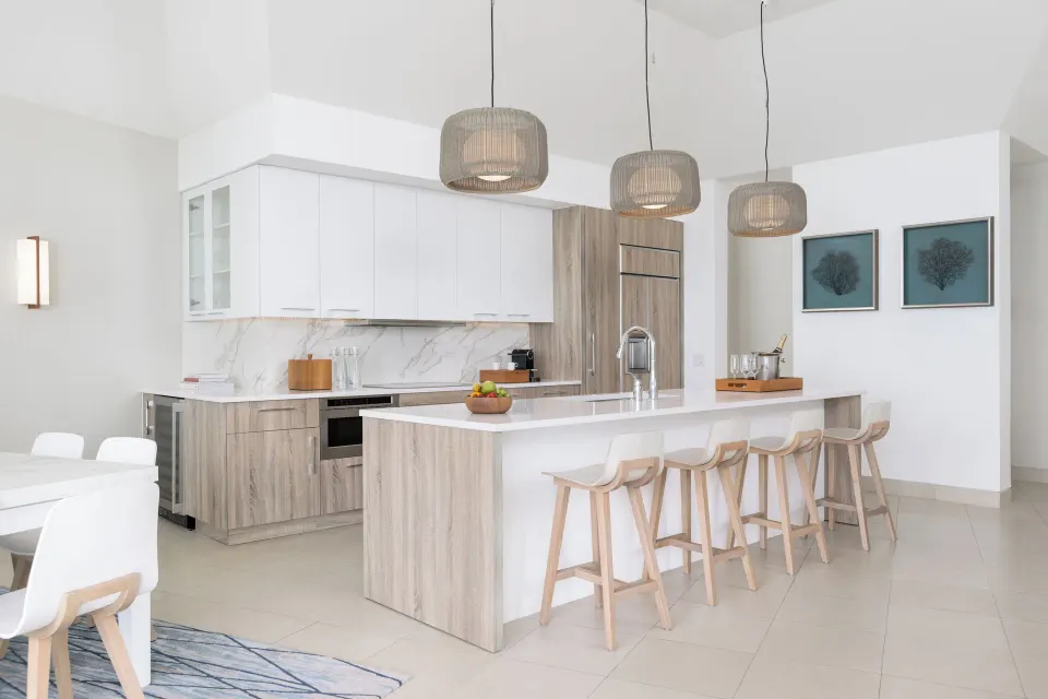 Penthouse one-bedroom suite kitchen island with bar stools at Wymara Resort and Villas.