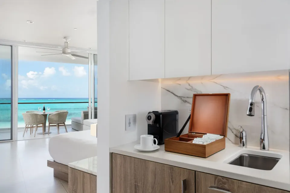 Studio Oceanfront kitchenette and balcony view at Wymara Resort and Villas.