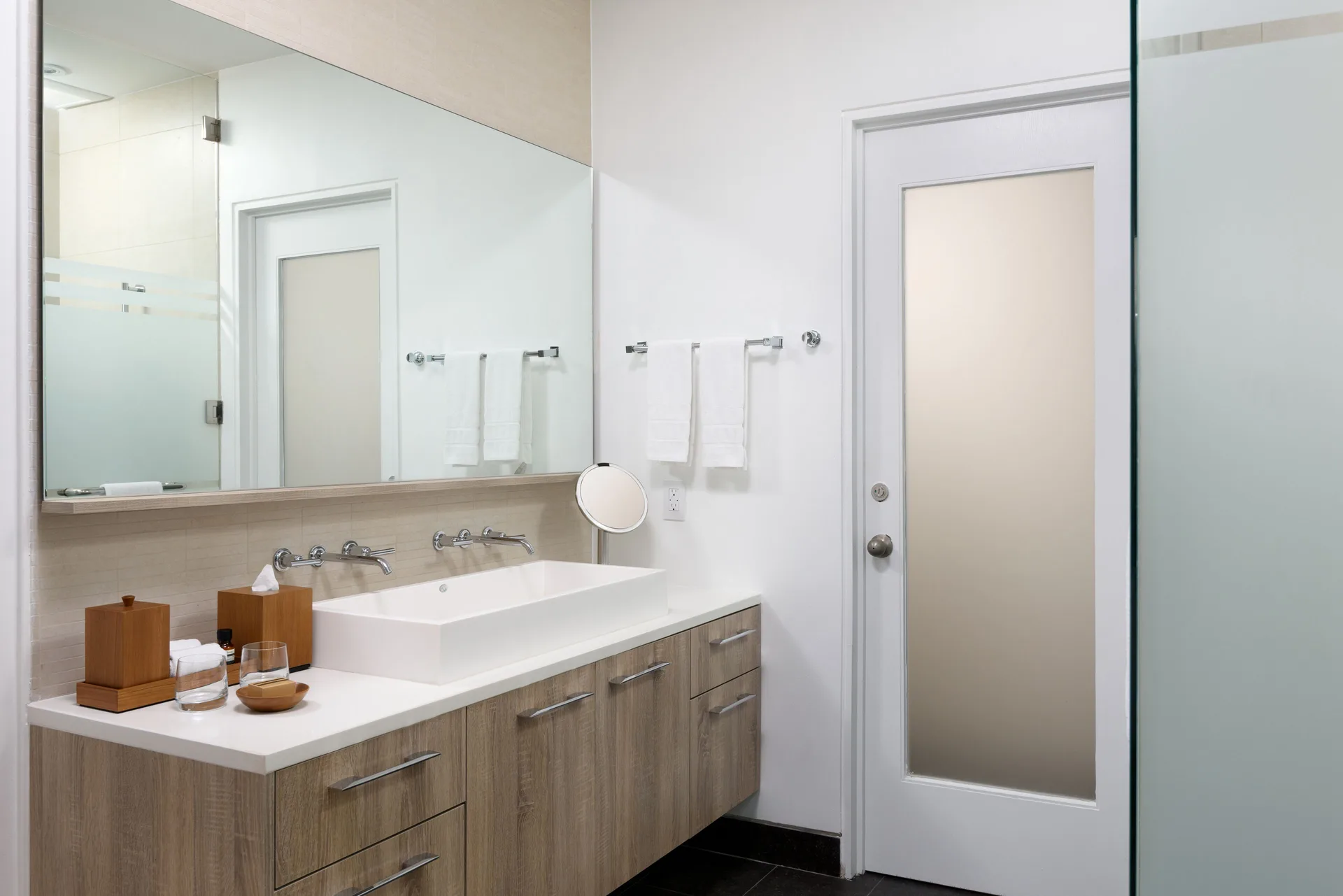 Studio Pool View bathroom vanity and glass shower at Wymara Resort and Villas.