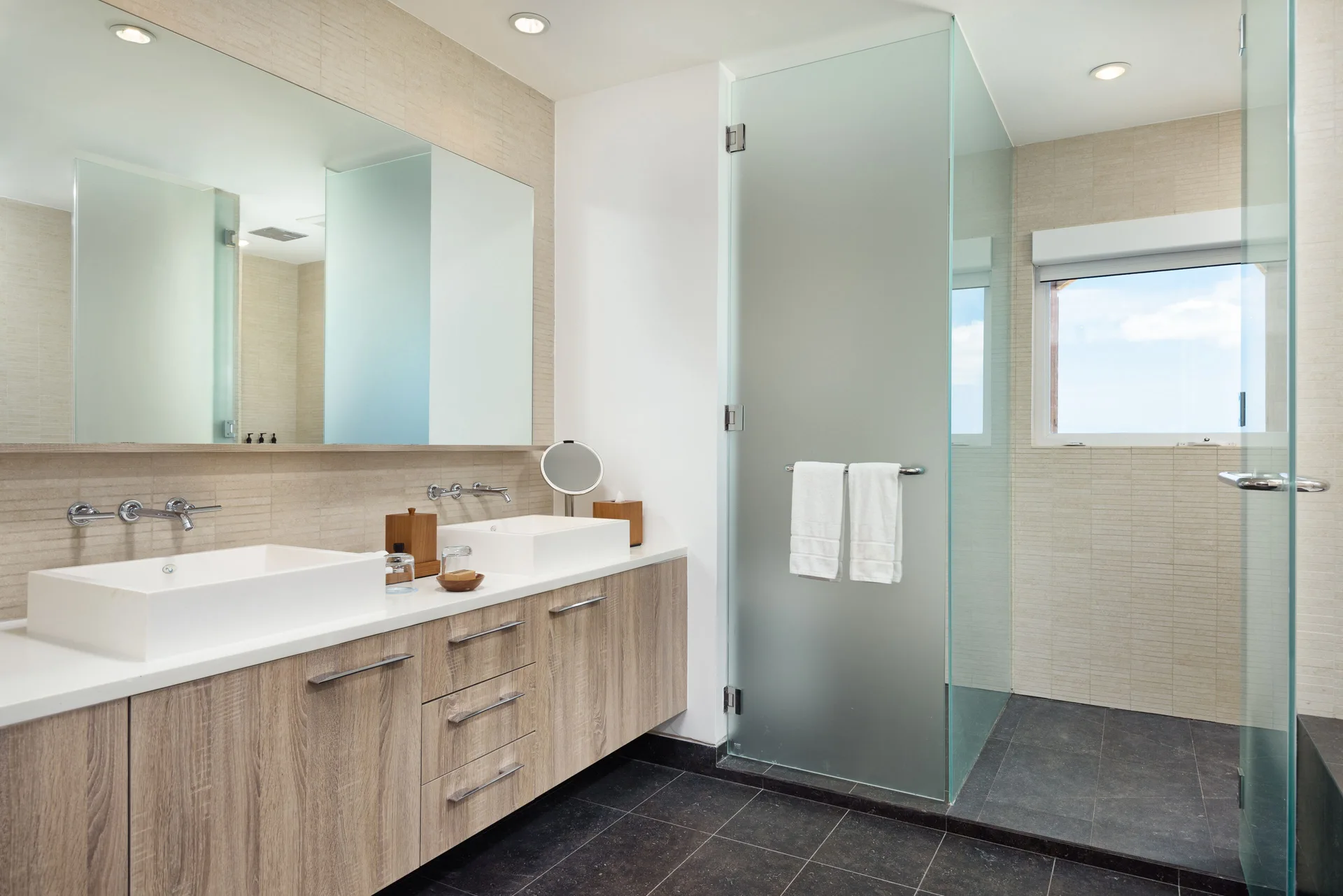 Oceanfront penthouse suite bathroom with double vanity at Wymara Resort and Villas.