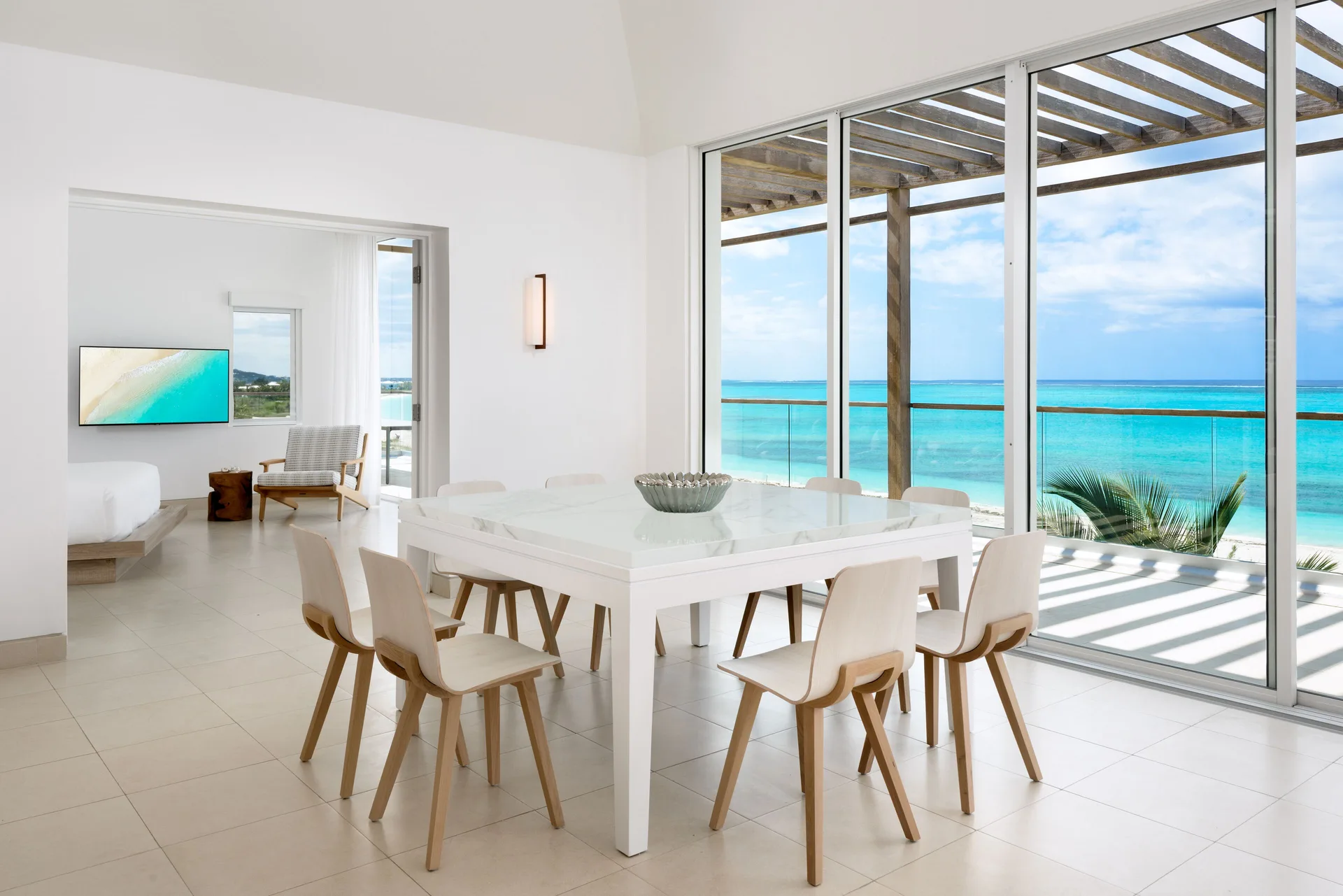 Oceanfront penthouse suite dining area with sea view at Wymara Resort and Villas.
