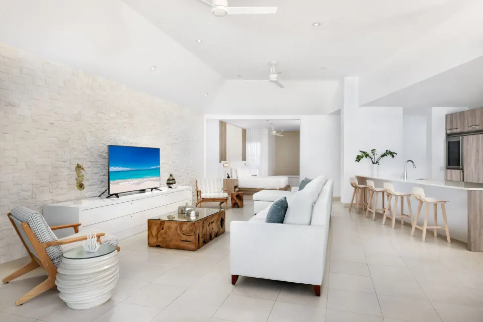 Oceanfront penthouse suite living area with kitchen and bedroom at Wymara Resort and Villas.