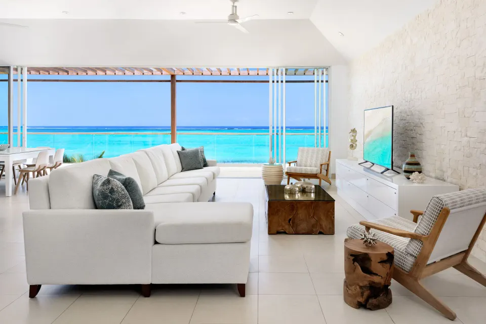 Oceanfront penthouse suite living room with ocean view at Wymara Resort and Villas.