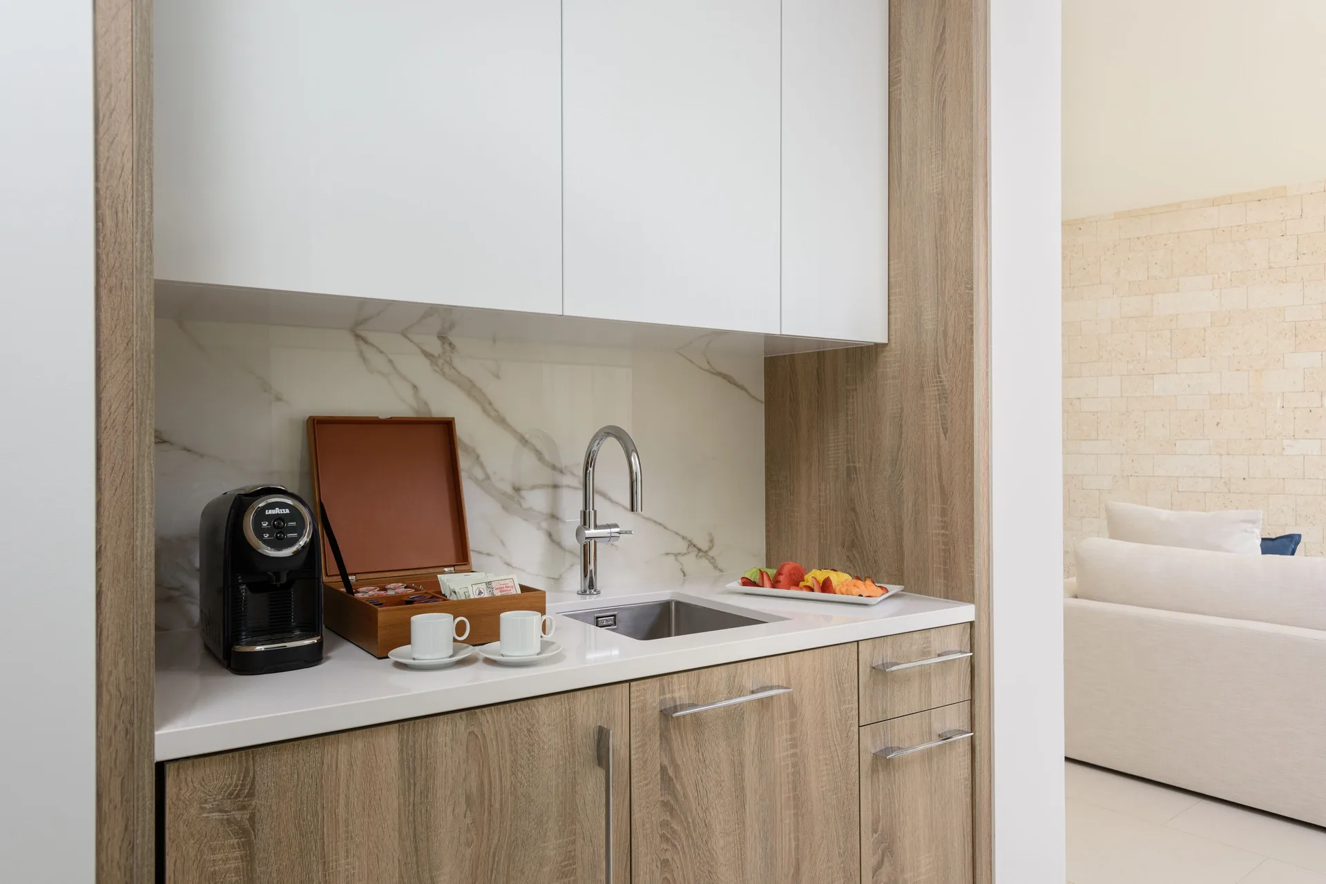 Villa kitchenette with coffee setup and sink at Wymara Resort and Villas.