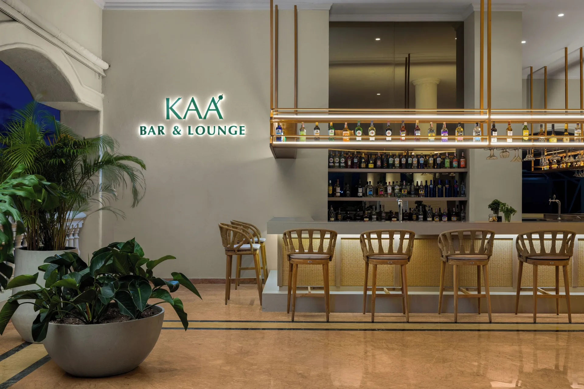 Kaa Bar & Lounge counter and illuminated sign at Wyndham Alltra Punta Cana.