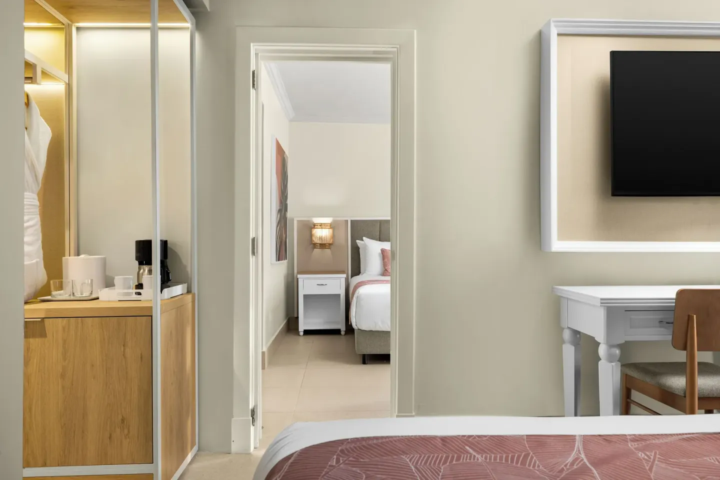 Junior Suite Multiple Beds Tropical View bedroom doorway at Wyndham Alltra Punta Cana.