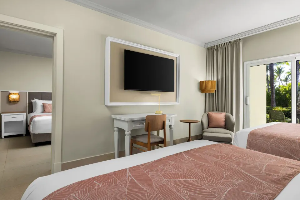Junior Suite Multiple Beds Tropical View room with two beds at Wyndham Alltra Punta Cana.