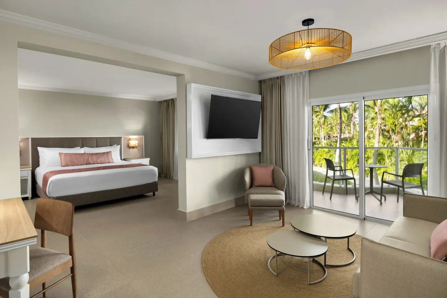 Junior suite with king bed, sofa bed and balcony at Wyndham Alltra Punta Cana.
