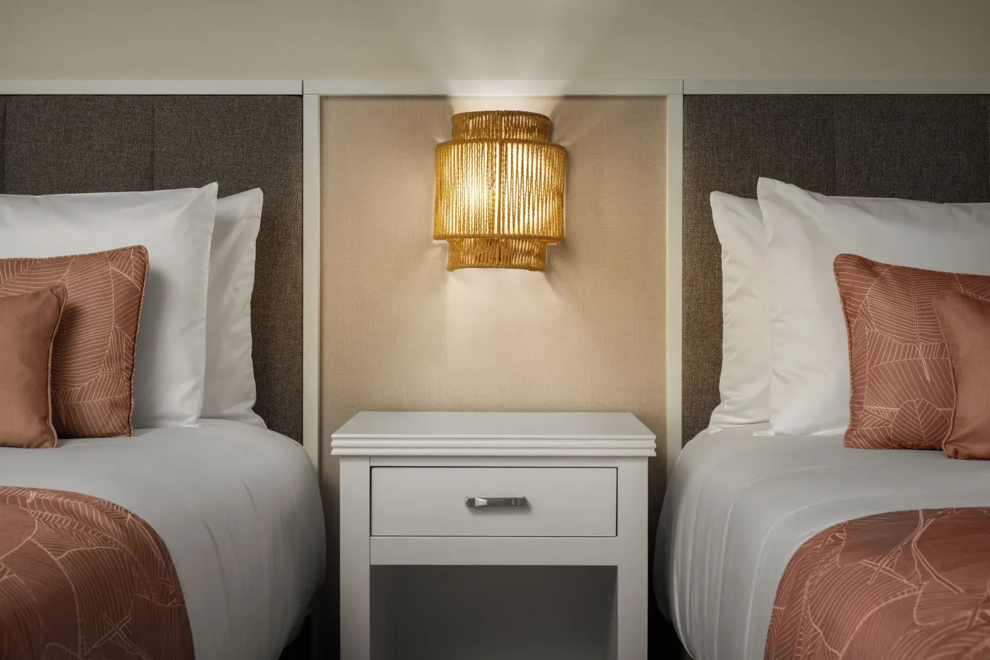 Standard tropical view room with two beds and central nightstand at Wyndham Alltra Punta Cana.
