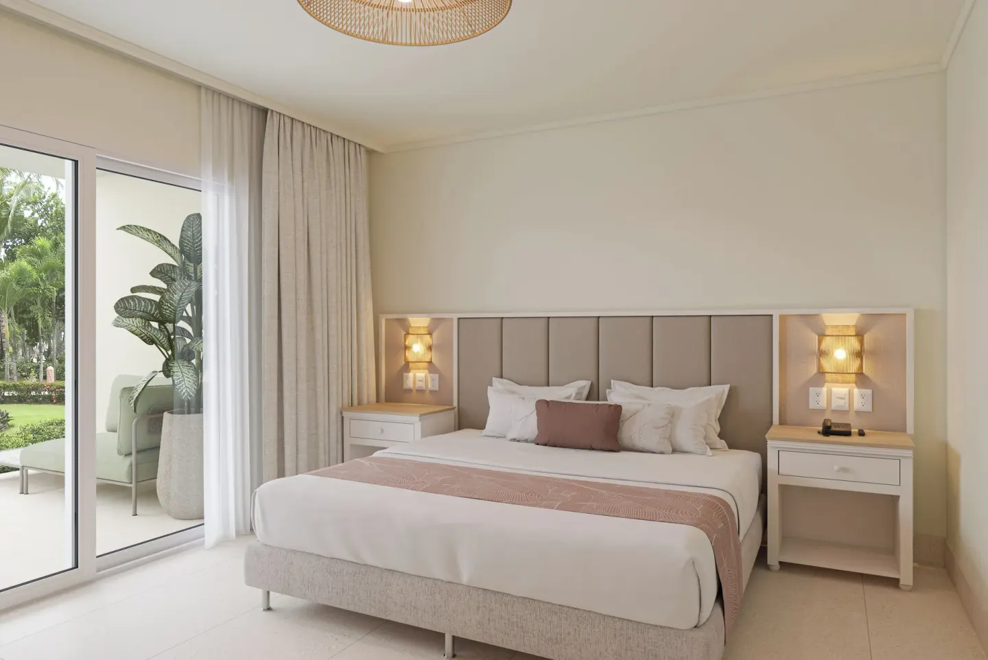 King bedroom with balcony in a two-bedroom suite at Wyndham Alltra Punta Cana.