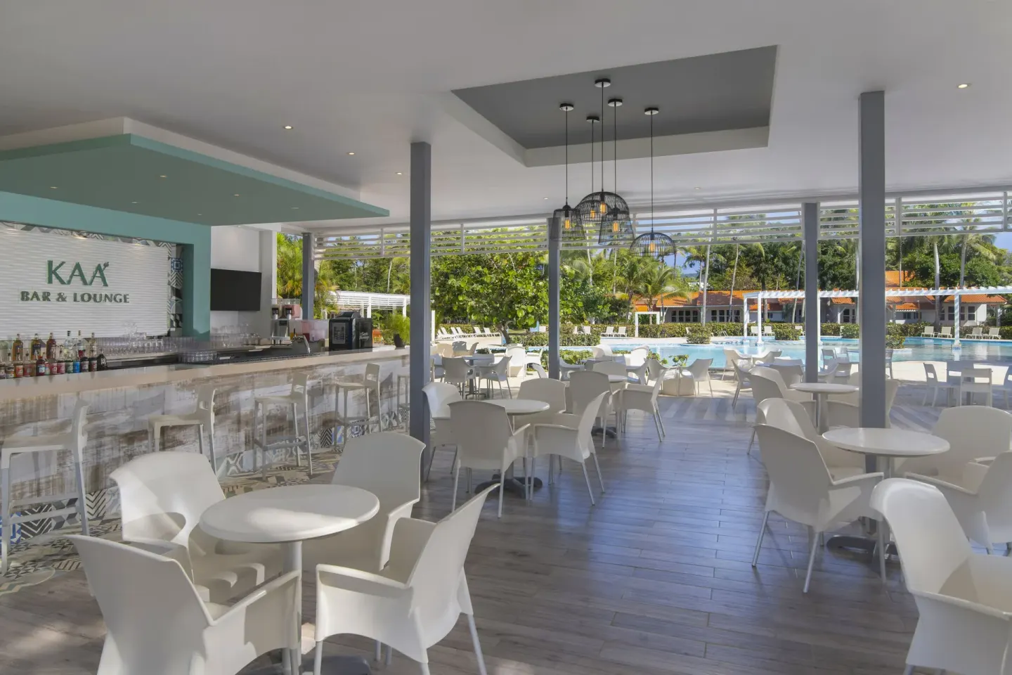 Kaa bar and lounge seating beside the pool at Wyndham Alltra Samana Resort.