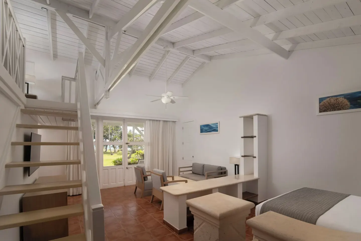 Club Bungalow Garden View room with king bed, high ceiling and garden-facing doors at Wyndham Alltra Samana Resort.