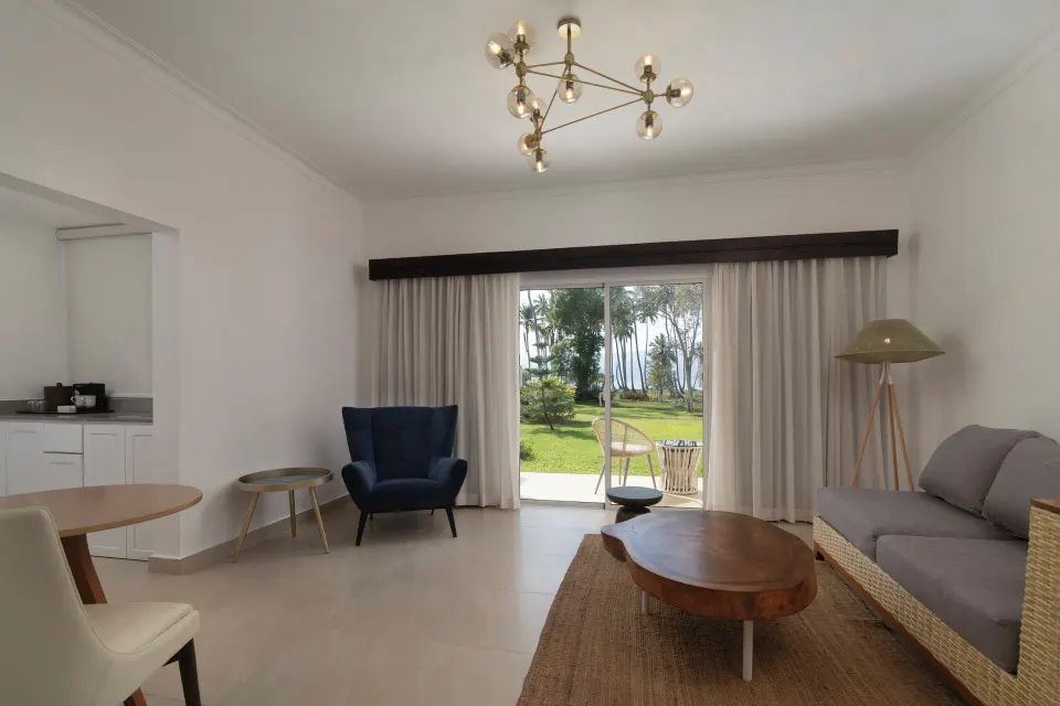 Club Bungalow Ocean View living area with patio at Wyndham Alltra Samana Resort.