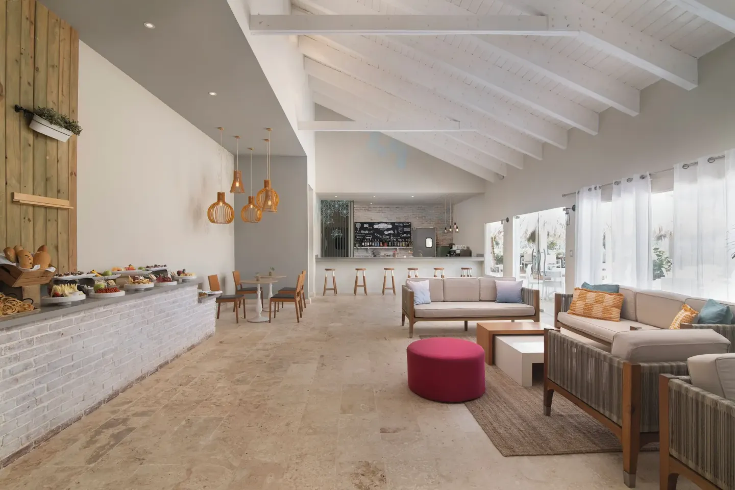 Club lounge buffet and seating at Wyndham Alltra Samana Resort.