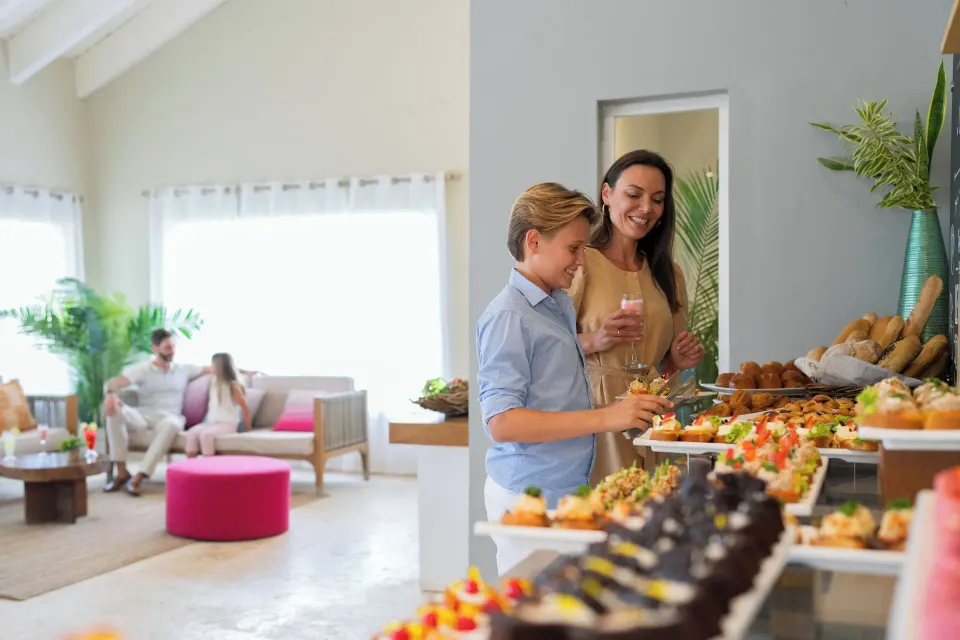 Guests choosing appetizers in the lounge at Wyndham Alltra Samana Resort.