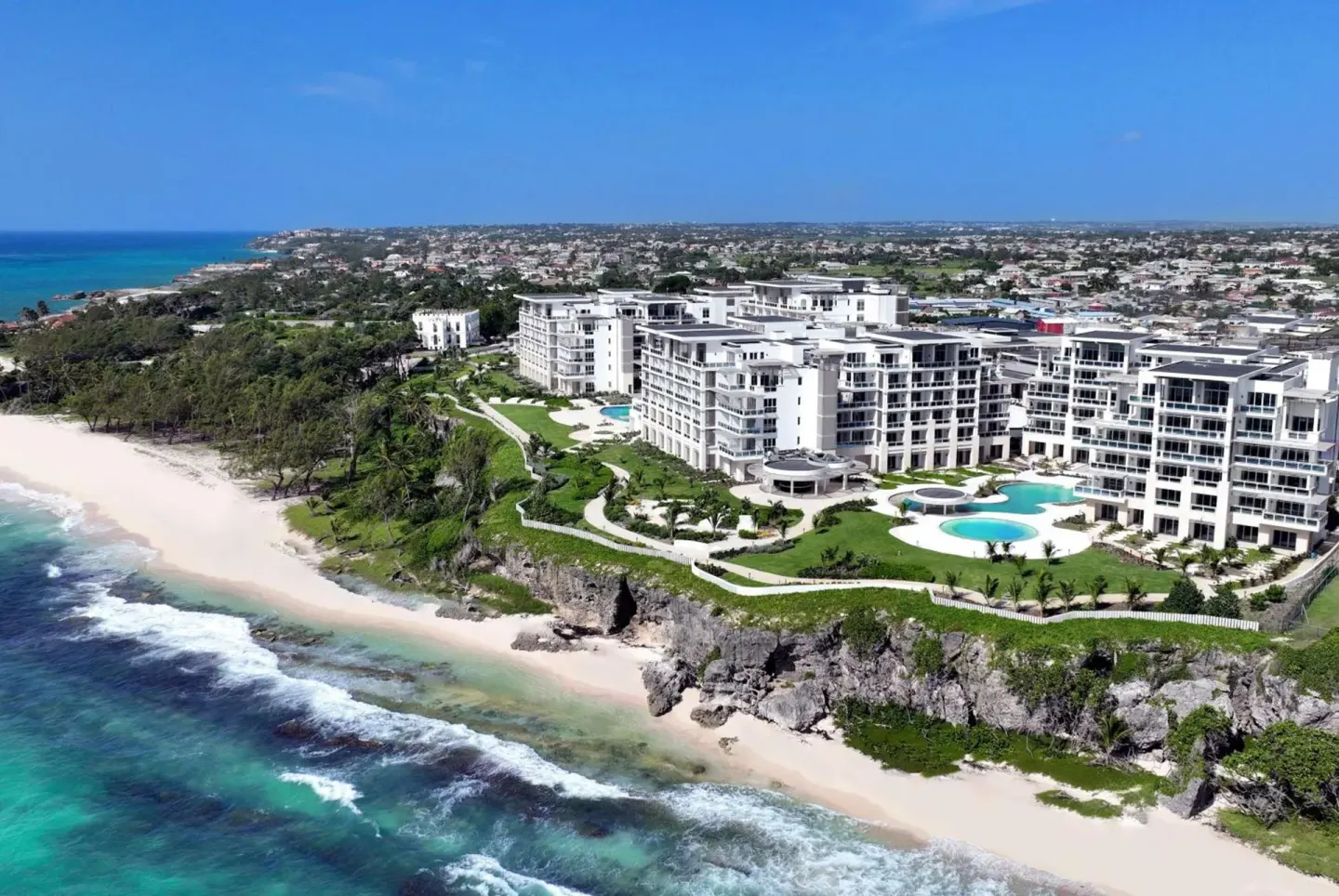 Beachfront resort and rocky shore at Wyndham Grand Barbados Sam Lords Castle.