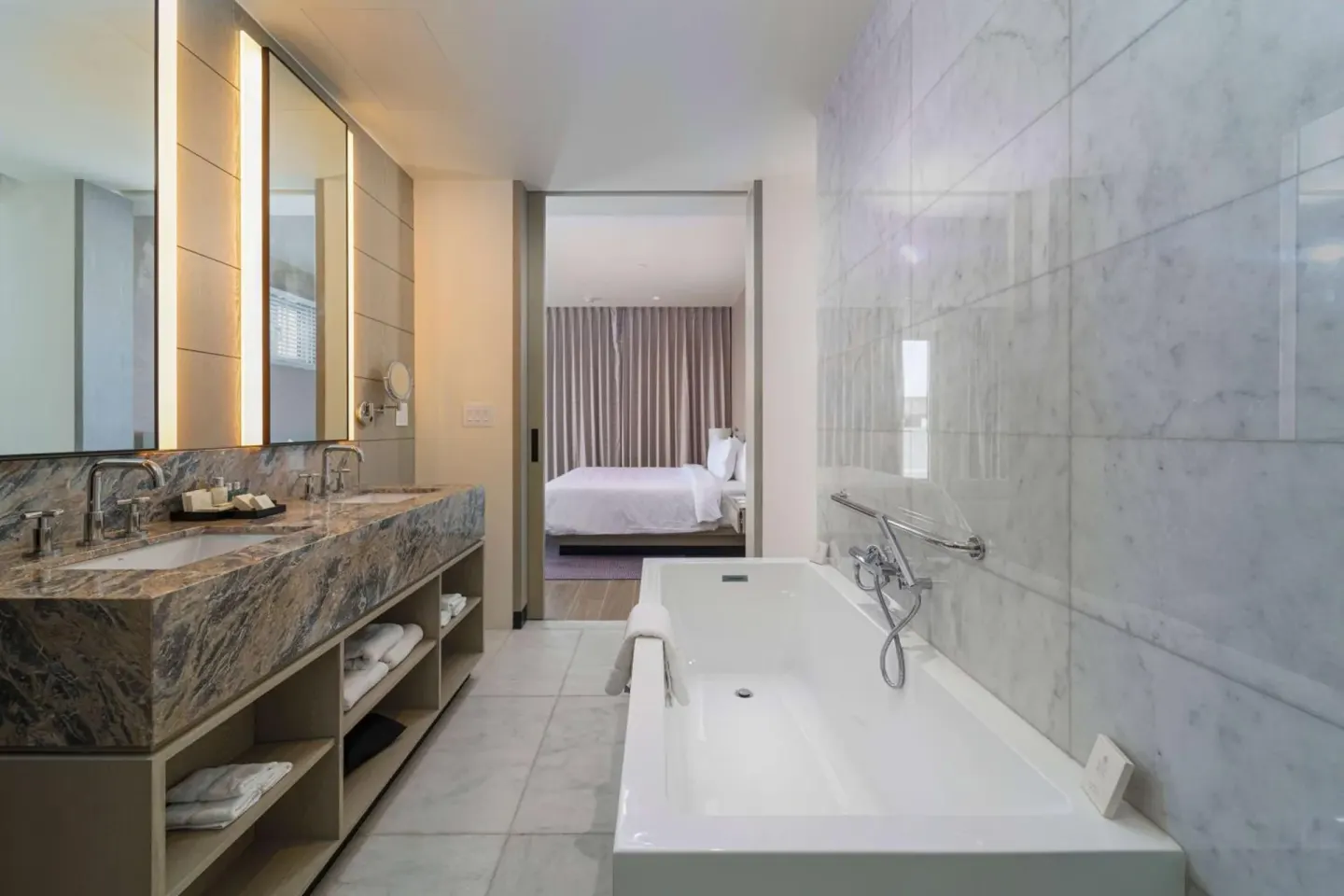 Marble bathroom with soaking tub at Wyndham Grand Barbados Sam Lords Castle, looking toward the bedroom.