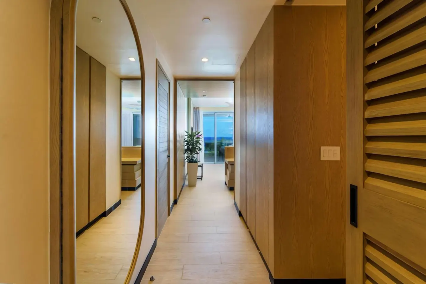 Wood-paneled guest room entry hall at Wyndham Grand Barbados Sam Lords Castle.