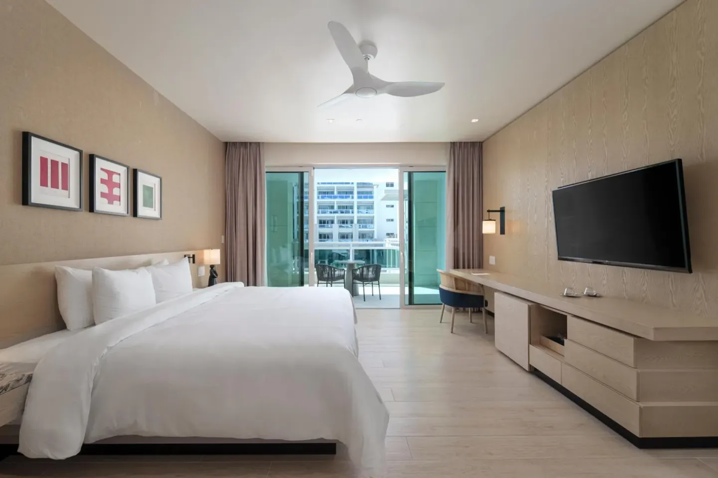 King bed guest room with balcony at Wyndham Grand Barbados Sam Lords Castle.