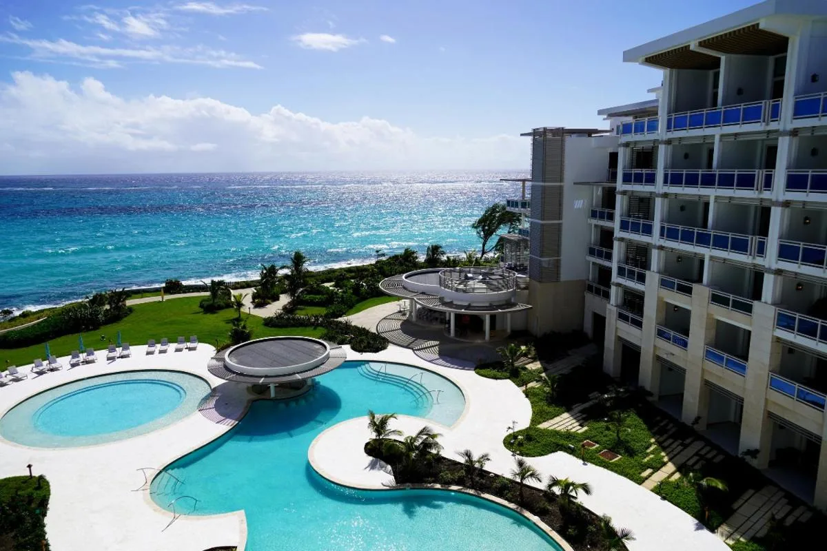 Pools, resort building, and oceanfront grounds at Wyndham Grand Barbados Sam Lords Castle.