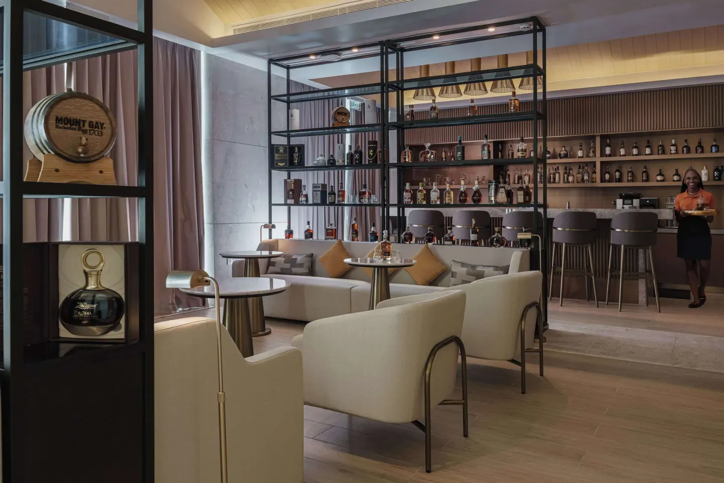 Rum bar lounge with bottle displays at Wyndham Grand Barbados Sam Lords Castle.