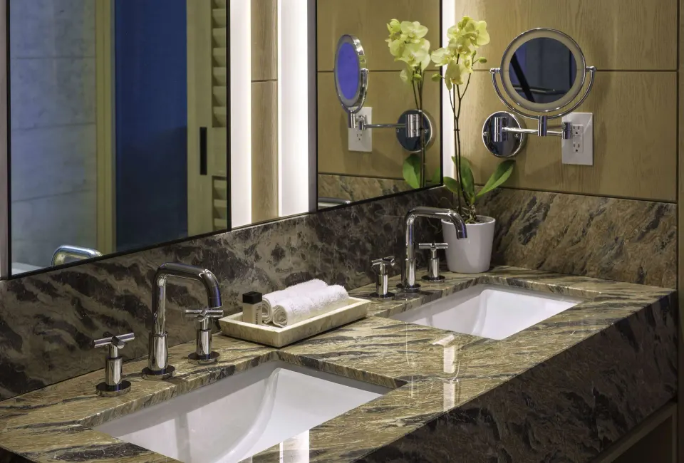 Double-sink bathroom vanity in a Deluxe Room at Wyndham Grand Barbados Sam Lords Castle.