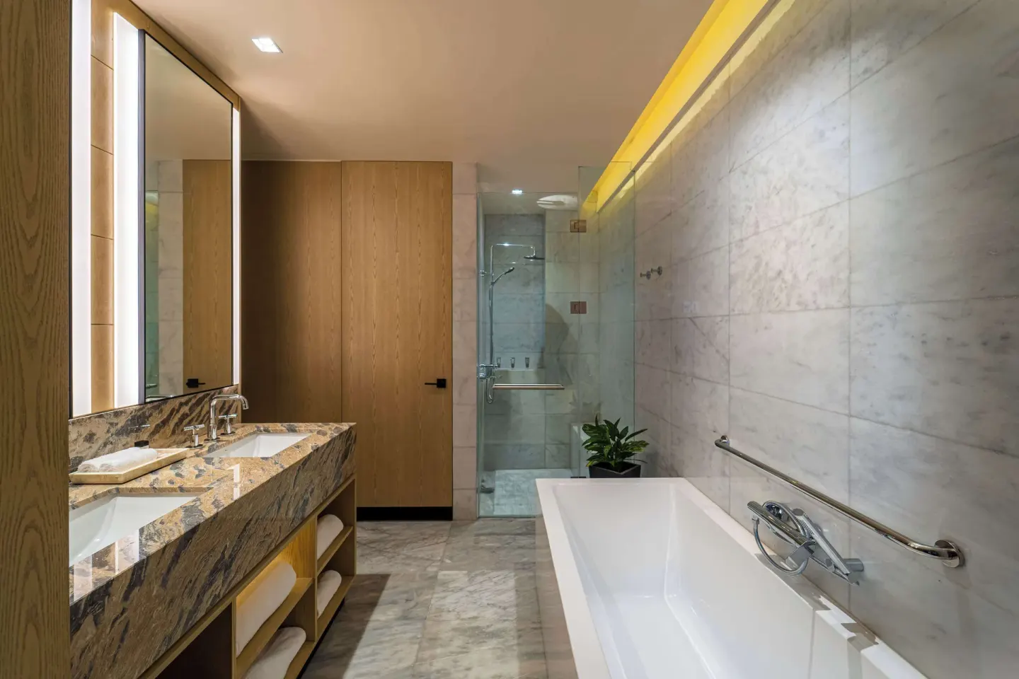 Suite bathroom with soaking tub and glass shower at Wyndham Grand Barbados Sam Lords Castle.