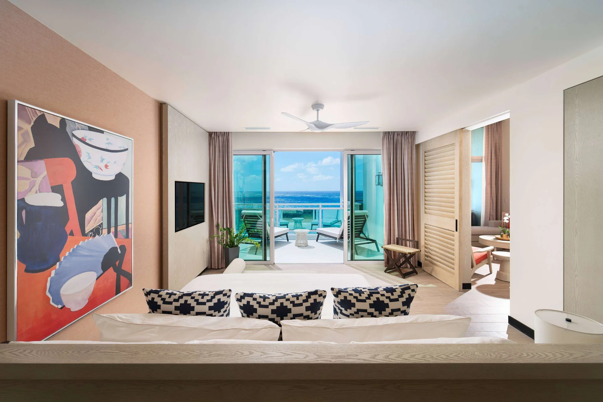 Suite living room and oceanfront balcony at Wyndham Grand Barbados Sam Lords Castle.
