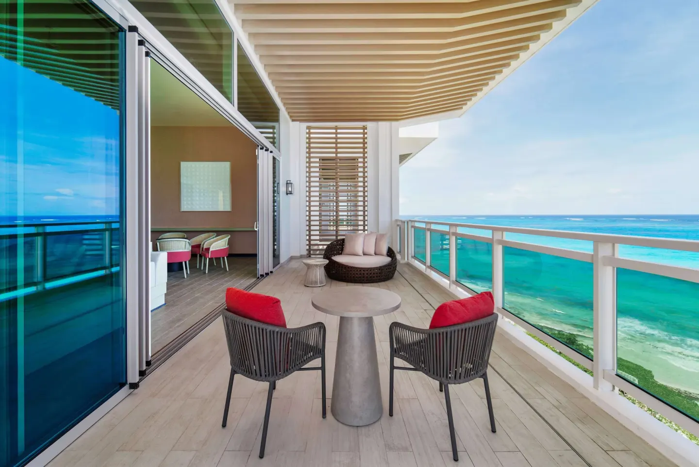 Ocean suite balcony with seating and sea view at Wyndham Grand Barbados Sam Lords Castle.