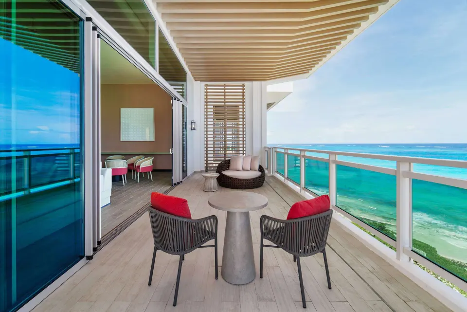 Ocean suite balcony with seating and sea view at Wyndham Grand Barbados Sam Lords Castle.