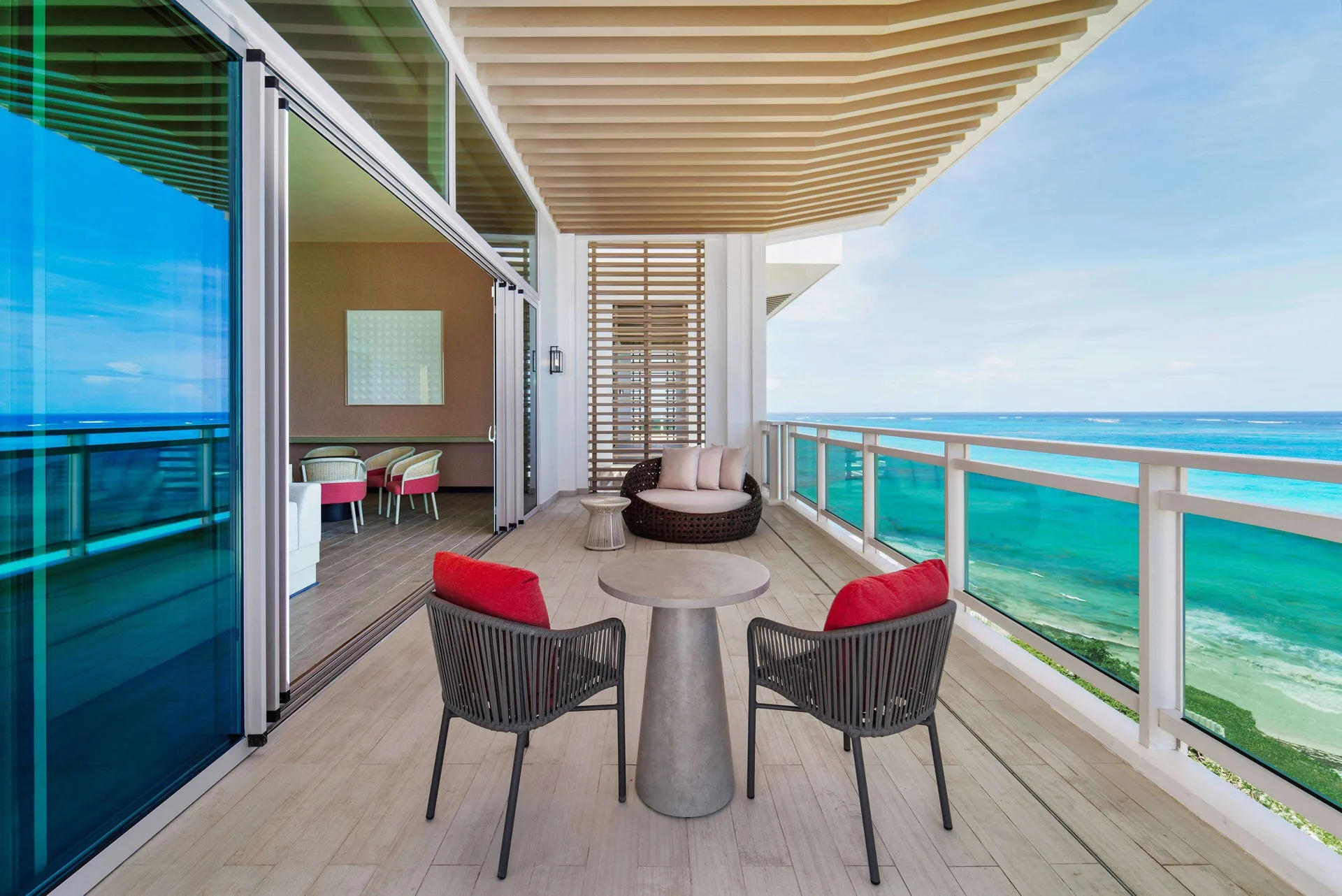 Ocean suite balcony with seating and sea view at Wyndham Grand Barbados Sam Lords Castle.