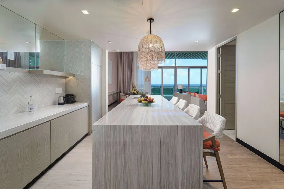Ocean suite kitchenette and island with sea view at Wyndham Grand Barbados Sam Lords Castle.